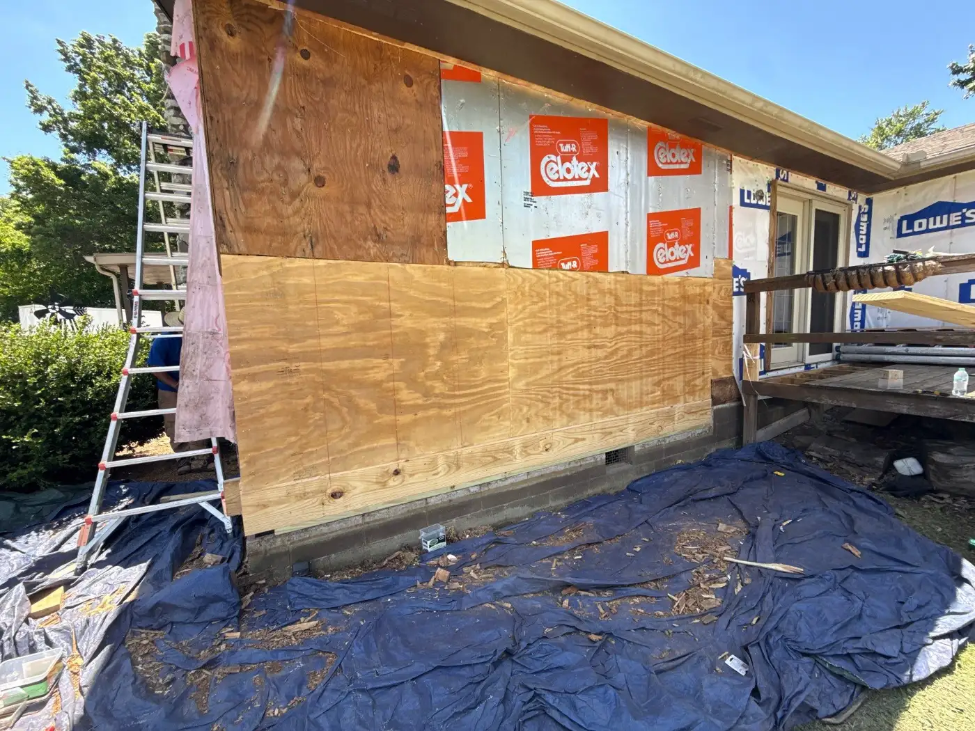 Wall rebuilt with new plywood sheathing